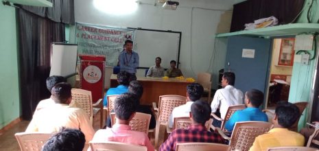 a brown French bulldog puppy laying down and looking up with a hopeful look in its eyes.